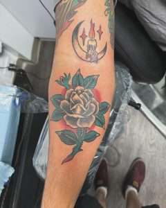 Rose and crescent moon forearm tattoo in neo-traditional colour, tattooed at Nu Nebula Tattoo