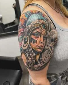 Portrait shoulder piece in full colour neo-traditional, tattooed at Nu Nebula Tattoo