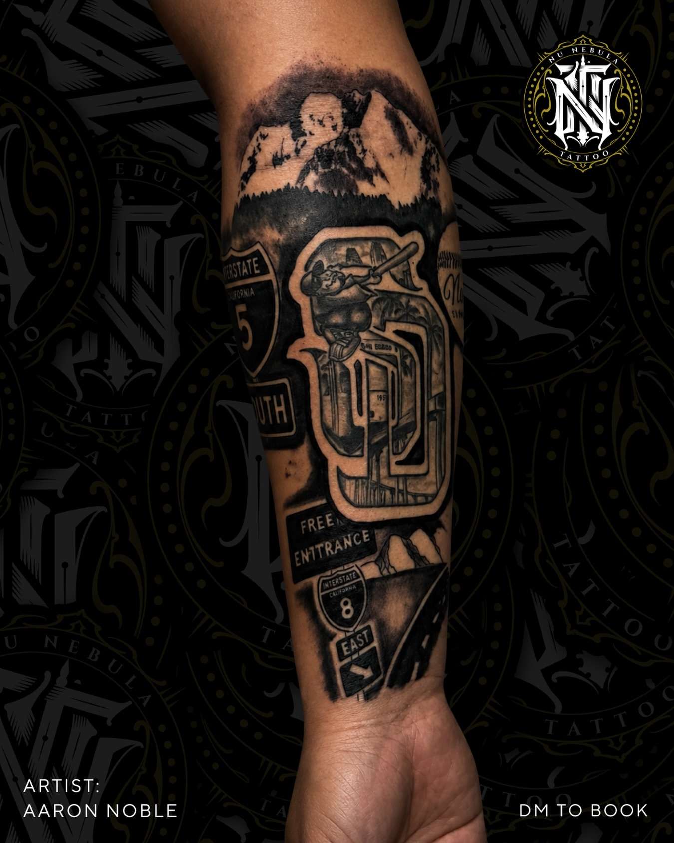 Clock tower forearm tattoo in black and grey realism, tattooed by Aaron Noble