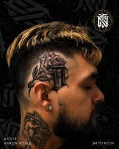 Ornamental scalp tattoo in black and grey, tattooed by Aaron Noble
