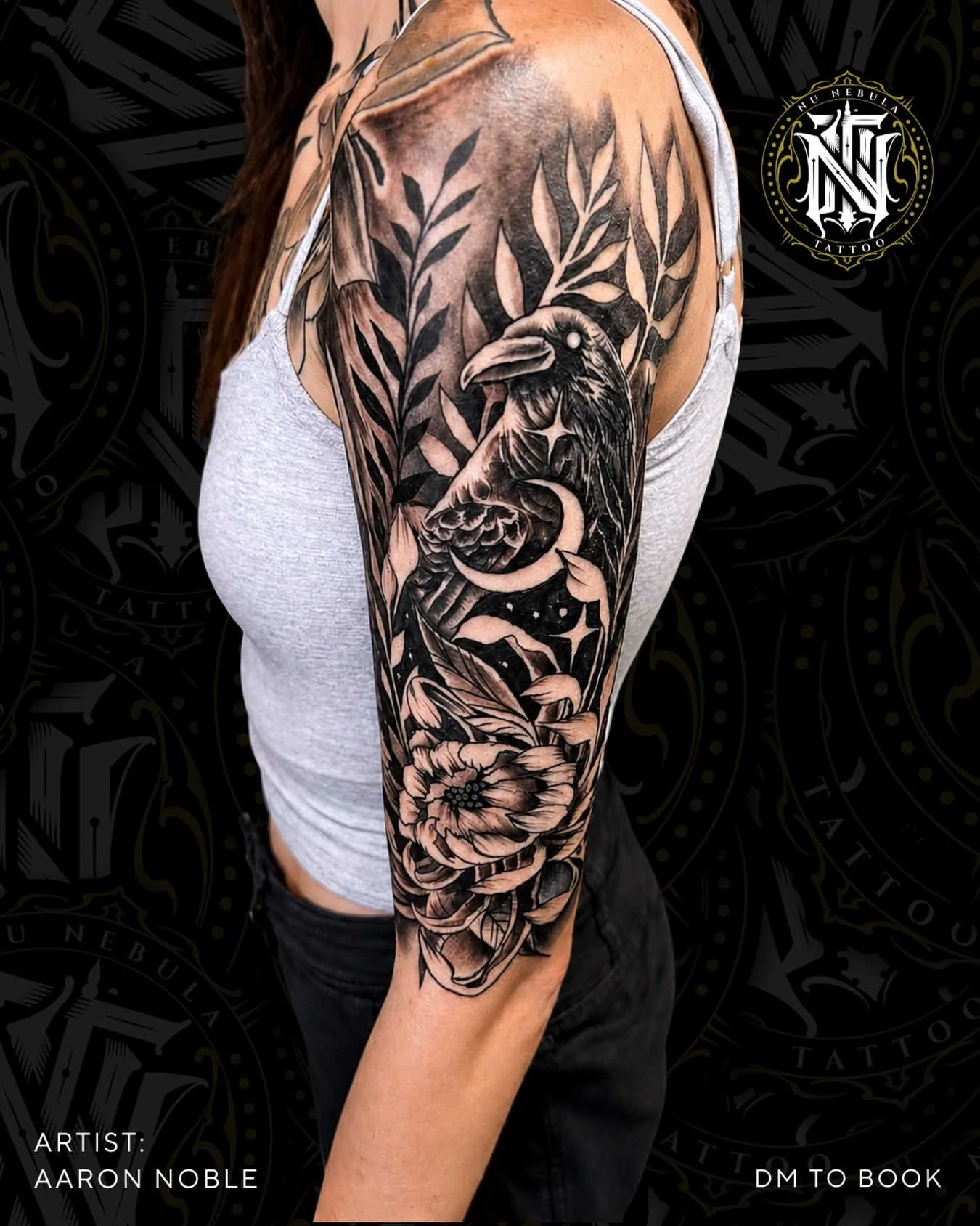Wheat and floral sleeve in fine-line black and grey, tattooed by Aaron Noble