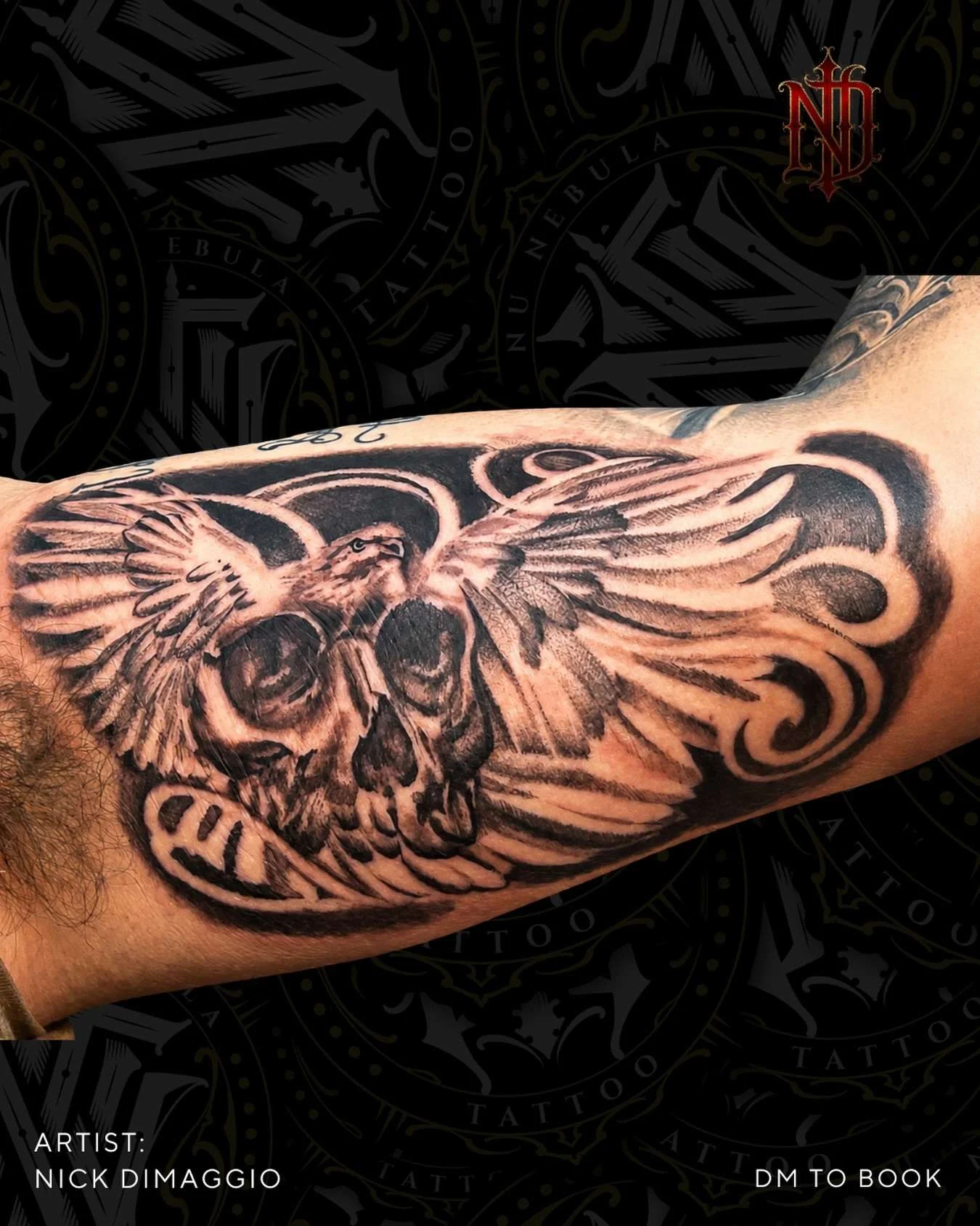 Skull and wings inner arm tattoo in black and grey realism, tattooed by Nick DiMaggio