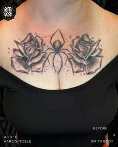 Roses and spider sternum tattoo in neo-traditional black and grey, tattooed by Aaron Noble