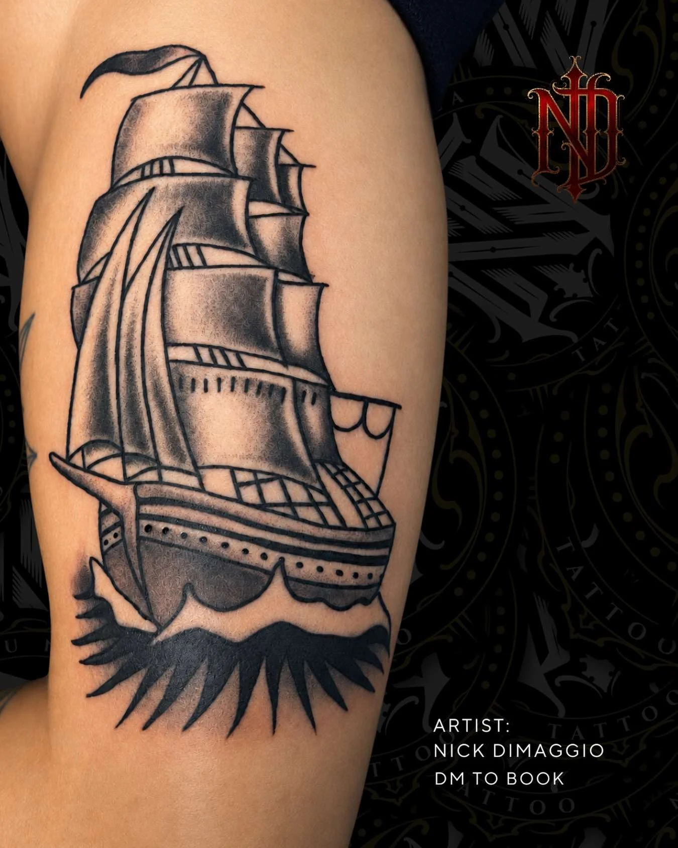 Traditional clipper ship arm tattoo in black and grey, tattooed by Nick DiMaggio
